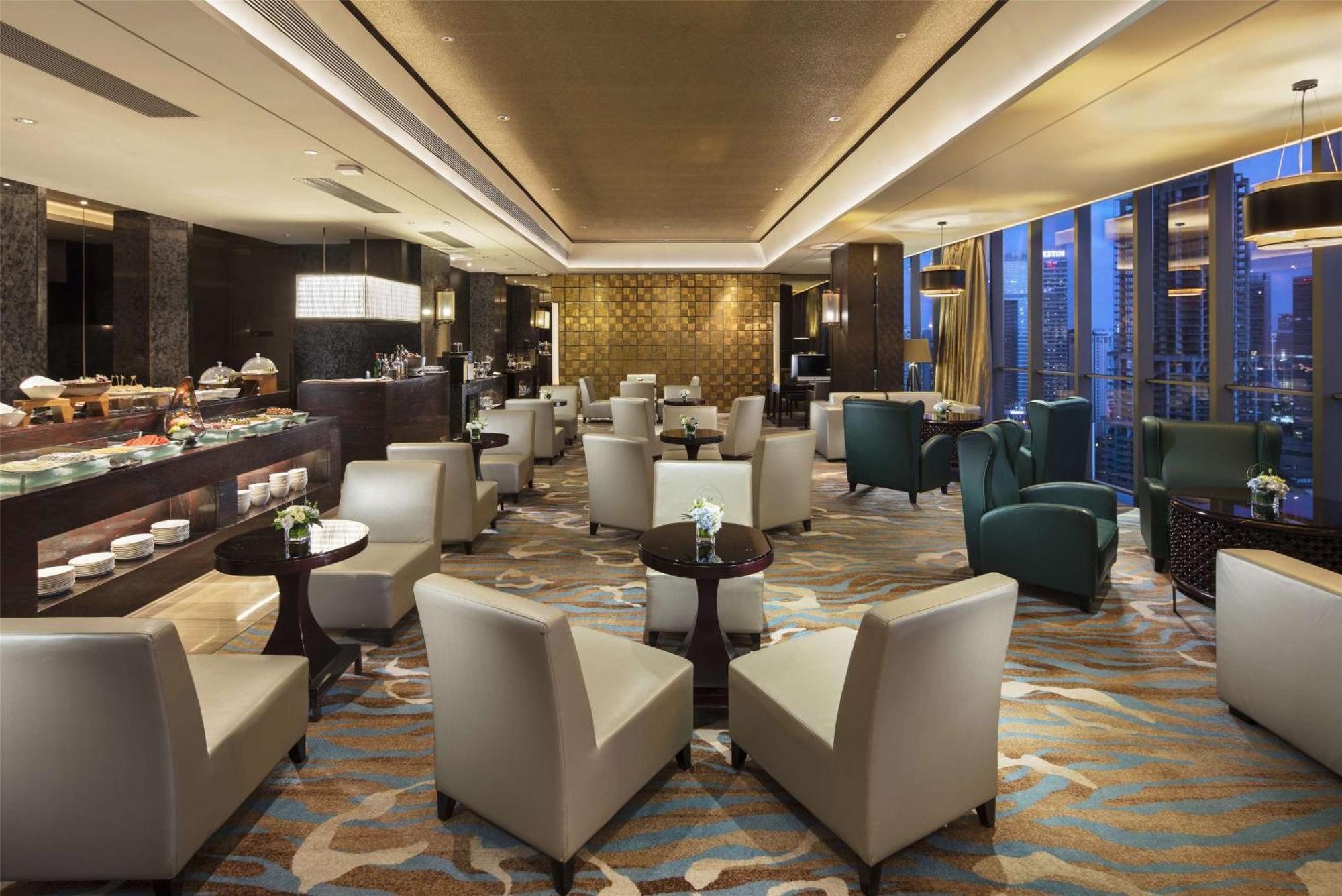 Hilton Guangzhou Tianhe - Free Shuttle Bus And Registration Counter Available During Canton Fair Period Exteriér fotografie The Club lounge at Beijing Capital International Airport